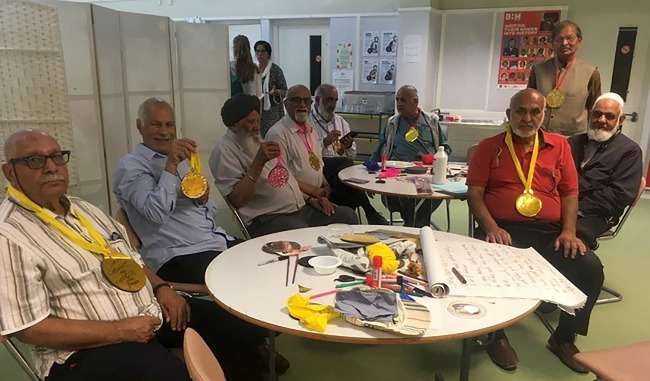 Image of men wearing home-made medals